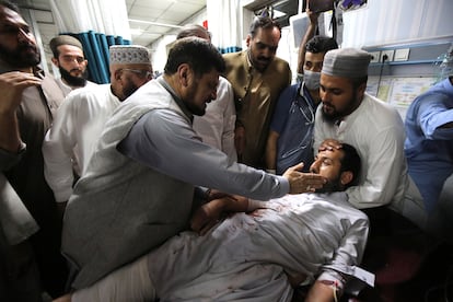 Governor of KPK province Haji Ghulam Ali visitis a victim of a blast targeting a gathering of Islamic political party Jamiat Ulma-e-Islam (JUI-F), at a hospital in Peshawar, Pakistan, on July 30, 2023.