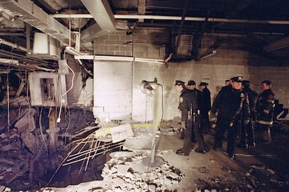 New York City police and firefighters inspect the bomb crater inside an underground parking garage of New York's World Trade Center on Feb. 27, 1993, the day after an explosion tore through it.