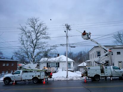 Central Maine Power Co. lineman John Baril works to restore electricity, on March 15, 2023, in Lewiston, Maine.