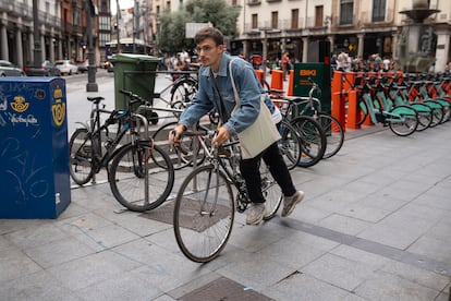  A young man takes his bike from a parking lot in downtown Valladolid, Spain, on June 21, 2023. 