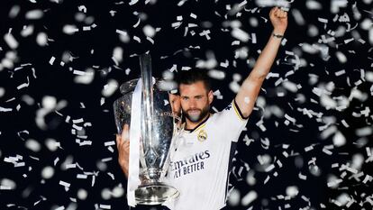 MADRID, SPAIN - JUNE 02: Nacho Fernandez of Real Madrid celebrates with the UEFA Champions League trophy during the Real Madrid UEFA Champions League Trophy Parade following their victory over Borussia Dortmund in the UEFA Champions League Final on June 02, 2024 in Madrid, Spain. (Photo by Angel Martinez/Getty Images)