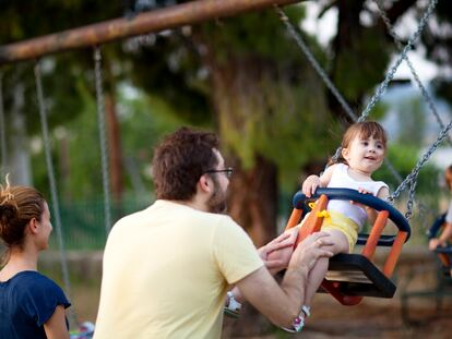 Father with his daughter in a playground