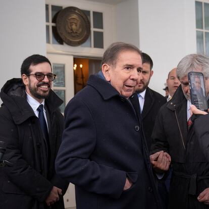 Venezuela's opposition leader Edmundo Gonzalez, center, speaks with reporters at the White House, Monday, Jan. 6, 2025, in Washington. (AP Photo/Mark Schiefelbein)