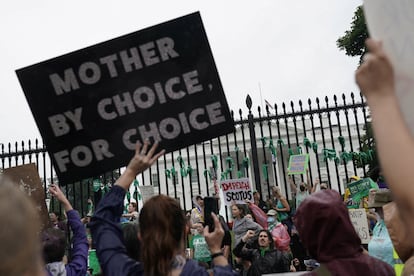Women's March activists hold signs outside the White House in the wake of the U.S. Supreme Court's decision to overturn the landmark Roe v Wade abortion decision in Washington, D.C., U.S., July 9, 2022.