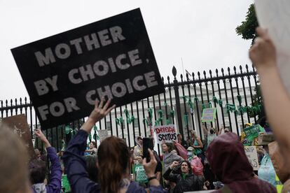 Women's March activists hold signs outside the White House in the wake of the U.S. Supreme Court's decision to overturn the landmark Roe v Wade abortion decision in Washington, D.C., U.S., July 9, 2022.