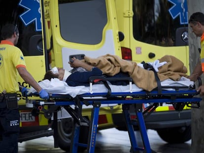 A man is attended to by emergency services after the attack