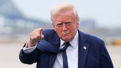 President Donald Trump points as he arrives at Newark Liberty International Airport in Newark, N.J., Saturday, April 26, 2025.
