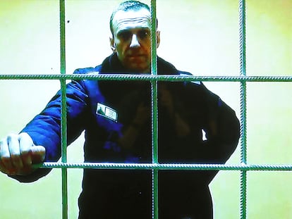 Alexei Navalny is seen on a screen via video link from the IK-2 corrective penal colony in Pokrov before a court hearing, in Moscow, Russia May 17, 2022.