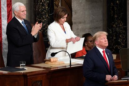 Nancy Pelosi, then Speaker of the House of Representatives, tears up a copy of Donald Trump's February 2020 State of the Union address, as Mike Pence applauds.