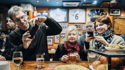 Diners photograph the famous Spanish omelette at Bar Nestor in San Sebastian.