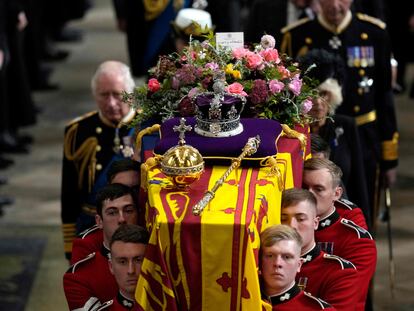 Britain's King Charles III (L) and Camilla, the Queen Consor follow the coffin of Queen Elizabeth II as it is carried out of Westminster Abbey during her funeral in central London, on September 19, 2022. (Photo by Frank Augstein / POOL / AFP)