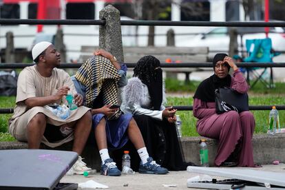 People gather in the aftermath of a shooting at an Eid al-Fitr event in Philadelphia, Wednesday, April 10, 2024