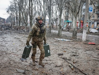 A Ukrainian serviceman carries weapons on an empty street, as Russia's attack on Ukraine continues, in the front line city of Bakhmut, in Donetsk region, Ukraine February 25, 2023. Radio Free Europe/Radio Liberty/Serhii Nuzhnenko via REUTERS THIS IMAGE HAS BEEN SUPPLIED BY A THIRD PARTY.