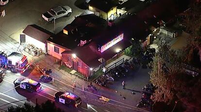 Authorities work at the scene of a fatal shooting on Aug. 23, 2023, at Cook's Corner, a biker bar in rural Trabuco Canyon, California.