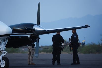 CBP agents stand by a plane believed to have carried Mexican drug lord Ismael "El Mayo" Zambada and Joaquín Guzmán López, who were arrested in El Paso, Texas, July 25, 2024. 