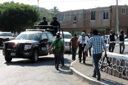 Vigilante groups and police on patrol in Arteaga, Michoacán.