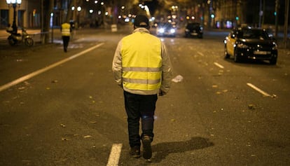 A taxi driver walks down Gran Via in Barcelona after the strike was called off.