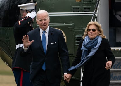 US President Joe Biden and First Lady Jill Biden walk on the South Lawn of the White House in Washington, DC, on January 23, 2022, as they return from a weekend in Rehoboth Beach, Delaware.