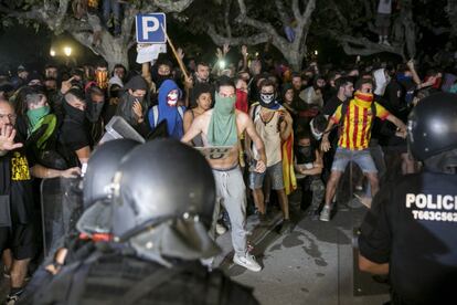 Pro-independence protesters face off with Catalan regional police, the Mossos d'Esquadra.