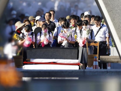 Visitors pay in front of the cenotaph dedicated to the victims of the atomic bombing at the Hiroshima Peace Memorial Park in Hiroshima