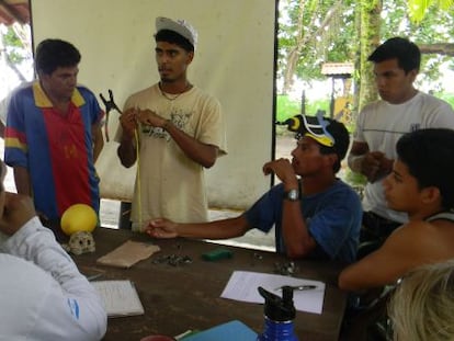 This image released by the Widecast organization shows Jairo Mora (center) instructing a group.