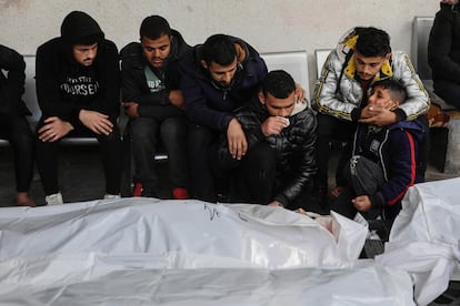 People mourn as they collect the bodies of friends and relatives killed in an airstrike, on January 21, 2024 in Rafah, Gaza.
