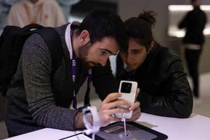 Visitors at the trade show browsing the Xiaomi stand.