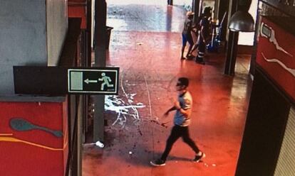 <strong>Younes Abouyaaqoub makes his escape. </strong> The terrorist makes his way through La Boqueria market after the attack, as seen here in security camera footage.