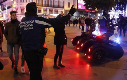 Madrid police telling people which way to walk along Preciados street.