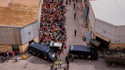 Unaccompanied minors who crossed into Spain outside a warehouse used as temporary shelter in Ceuta on Wednesday. 