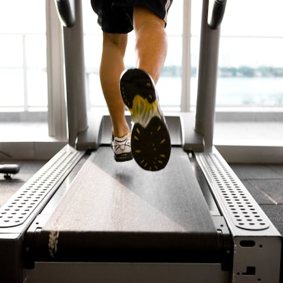 Man exercising on a treadmill, focus on treadmill, canon 1Ds mark III