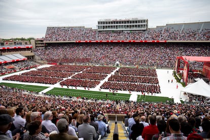 Attendees watch the 170th University of Wisconsin-Madison commencement ceremony at Camp Randall Stadium in Madison