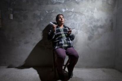 María Elena poses with her work instruments.