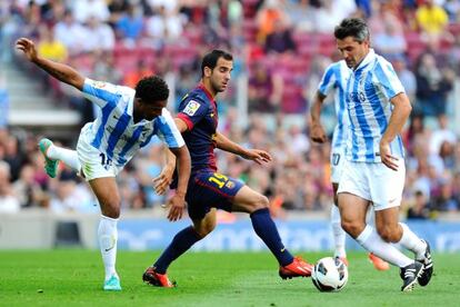 Eliseu y Toulalan, ante Montoya en el último partido de Liga.