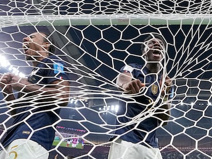 France's Jules Kounde, left, and France's Aurelien Tchouameni celebrate after the World Cup semifinal soccer match between France and Morocco at the Al Bayt Stadium in Al Khor, Qatar, Wednesday, Dec. 14, 2022. France won the match 2-0. (AP Photo/Manu Fernandez)