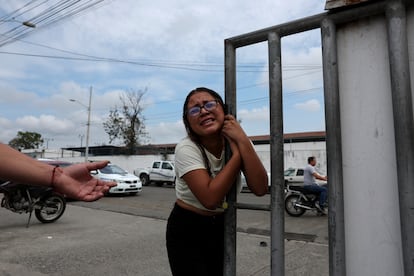 A woman arrives at the police station after being assaulted in Guayaquil yesterday.