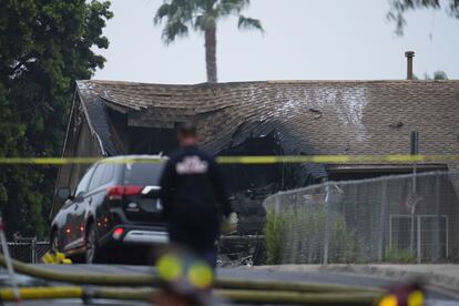 A house damaged by the impact of the plane.
