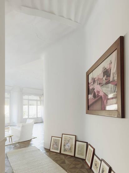 The author’s art collection on the white walls of her apartment.