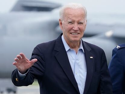 President Joe Biden waves to members of the media as he walks to board Air Force One at Dover Air Force Base in Delaware, Sunday, July 9, 2023.