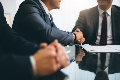Business people shaking hands, finishing up a meeting
