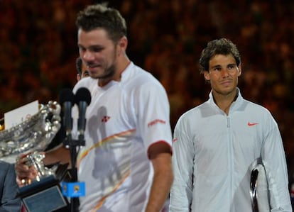 Rafael Nadal looks on as Stan Wawrinka delivers his winner&#039;s address. 