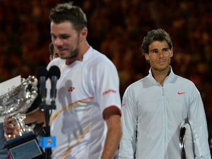 Rafael Nadal looks on as Stan Wawrinka delivers his winner&#039;s address. 