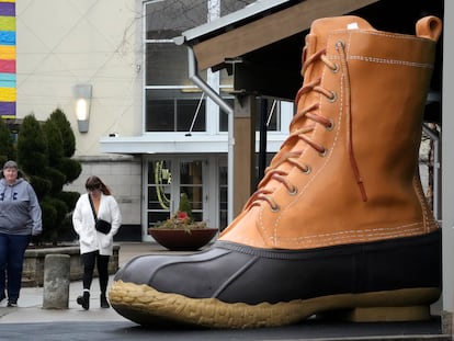 Shoppers pass an large L.L. Bean boot displayed outside an L.L. Bean store in Pittsburgh on Monday, Jan. 30, 2023.