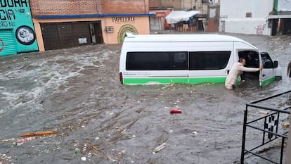 A vehicle is swept away by flooding in the Magdalena Contreras municipality in July.