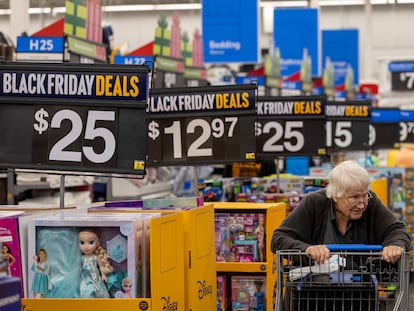Black Friday deals line the aisles as shoppers look for bargains at a Walmart Supercenter in Burbank (California), on November 14, 2023.