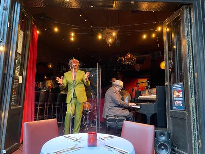 Singer Lezlie Harrison performs for an audience seated on the sidewalk from inside the Smoke Jazz & Super Club, Oct. 14, 2020.