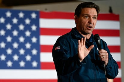 Republican presidential candidate and Florida Governor Ron DeSantis gestures as he speaks at a campaign event at The Thunderdome in Newton, Iowa, December 2, 2023.