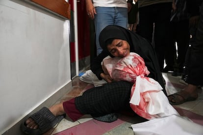 A Palestine cries on the body of her young son, who was the victim of an Israeli air attack on Wednesday, in Gaza.