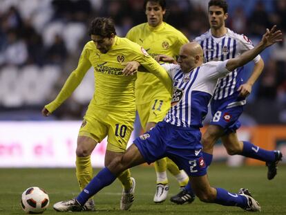 Manuel Pablo trata de arrebatar el balón a Cani.