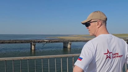 Russian-installed leader of Ukraine's Kherson region Vladimir Saldo inspects the damaged Chonhar bridge connecting Russian-held parts of Kherson region to the Crimean peninsula